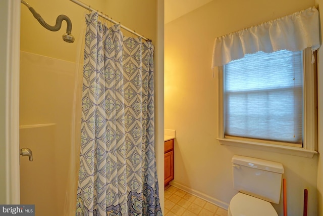 bathroom with vanity, a shower with curtain, and toilet