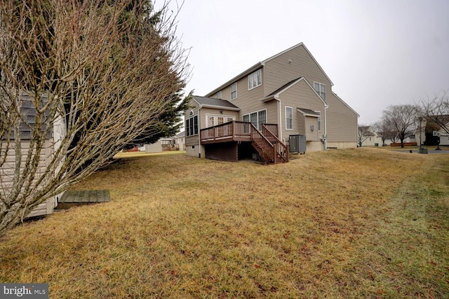 back of house with cooling unit, a yard, and a deck