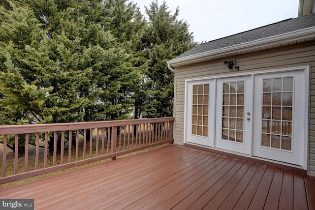 wooden deck featuring french doors