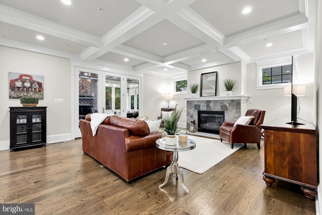 living room featuring beamed ceiling, wood-type flooring, and coffered ceiling