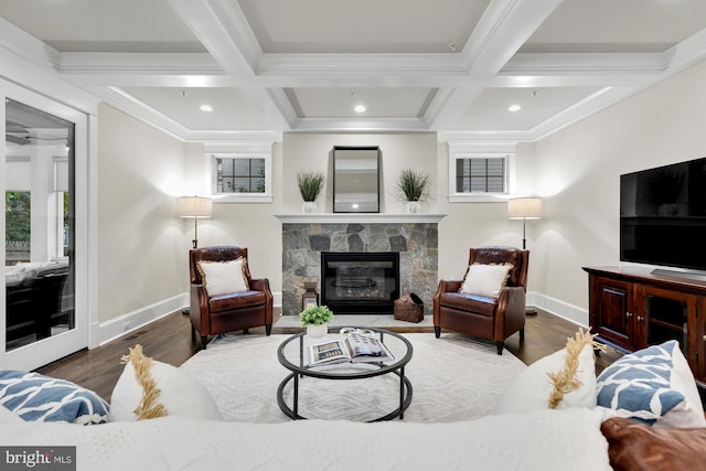 living room featuring beamed ceiling, a stone fireplace, coffered ceiling, and dark hardwood / wood-style flooring