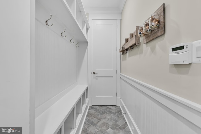 mudroom featuring crown molding