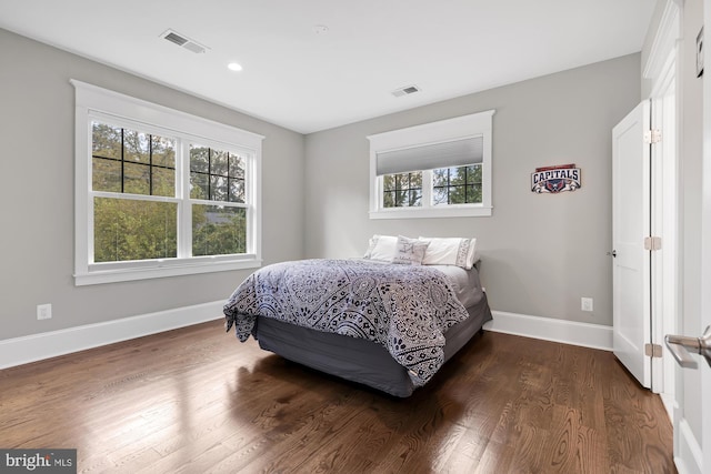 bedroom featuring dark hardwood / wood-style flooring