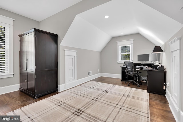 office space with lofted ceiling and dark hardwood / wood-style floors