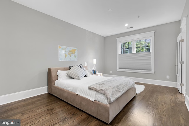 bedroom featuring dark hardwood / wood-style floors