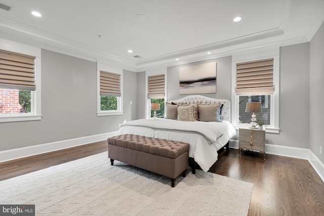 bedroom featuring ornamental molding and hardwood / wood-style floors