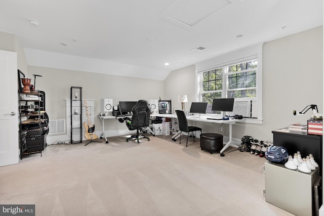 office area featuring lofted ceiling and light colored carpet