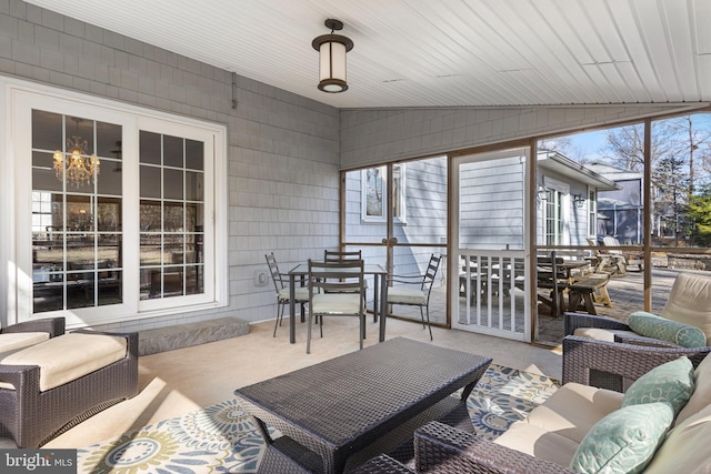 sunroom with vaulted ceiling