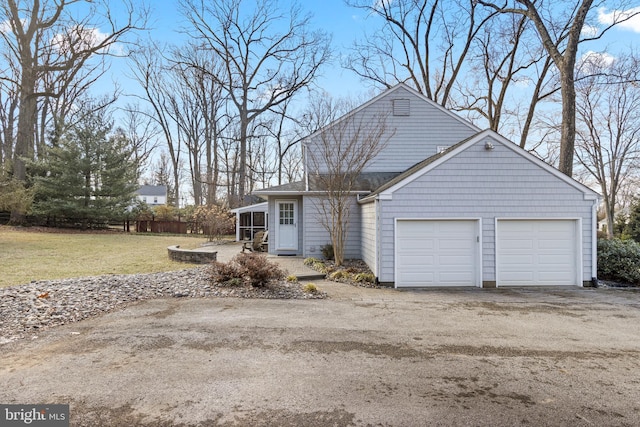 view of front of home with a garage and a front yard