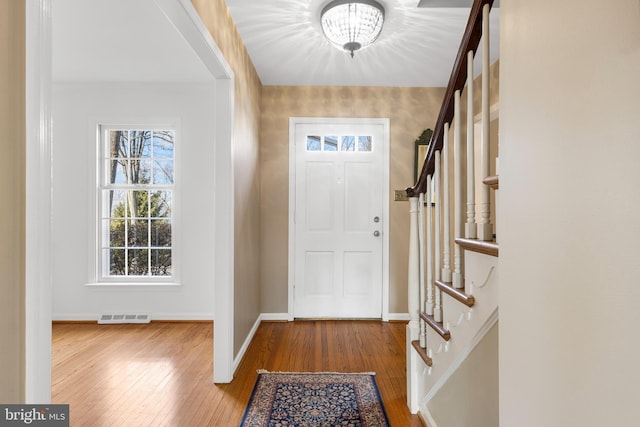 foyer entrance featuring wood-type flooring