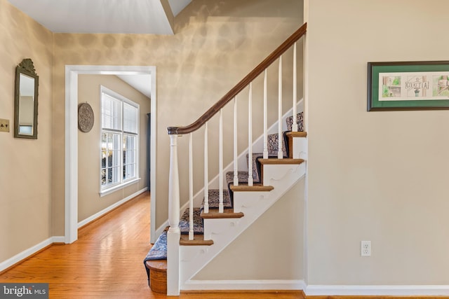 staircase featuring hardwood / wood-style floors