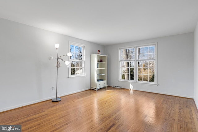 unfurnished room featuring light wood-type flooring