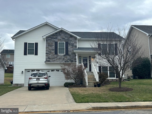 view of front of home featuring a garage and a front yard