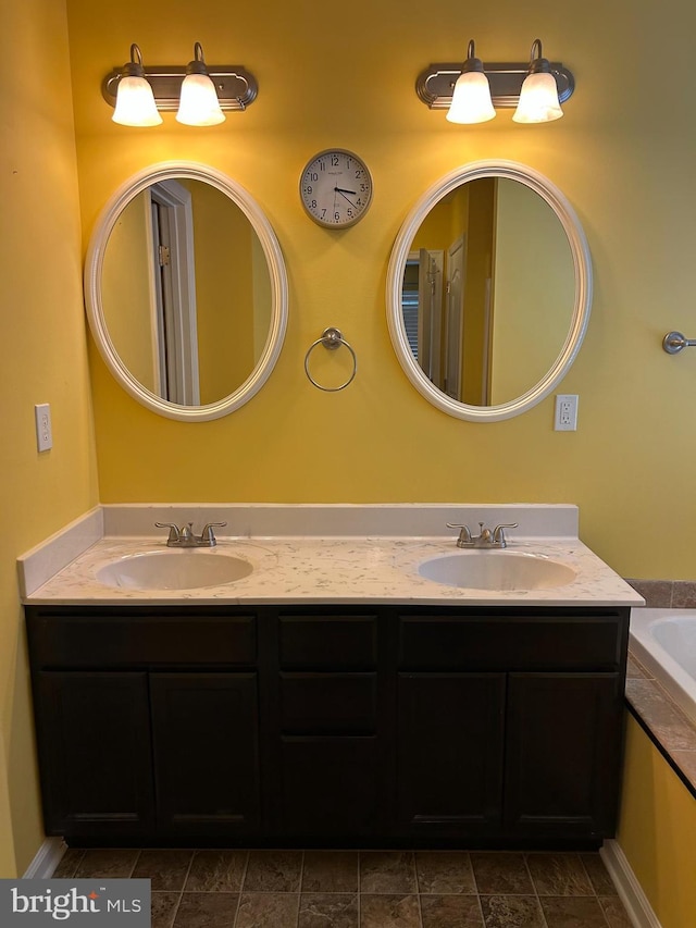 bathroom featuring vanity and a bathing tub