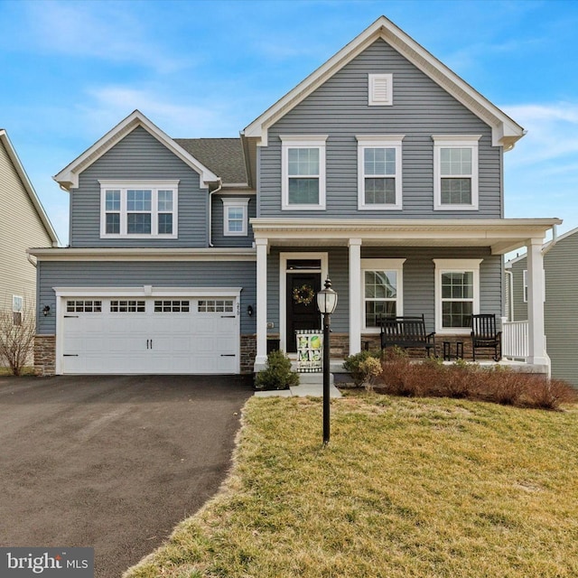 view of front of property with aphalt driveway, stone siding, a porch, and an attached garage