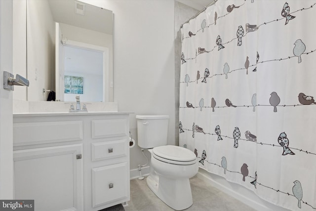 bathroom featuring vanity, tile patterned floors, toilet, and visible vents