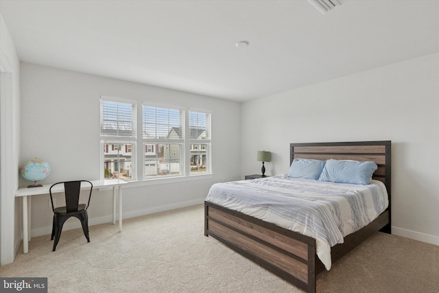 carpeted bedroom featuring baseboards