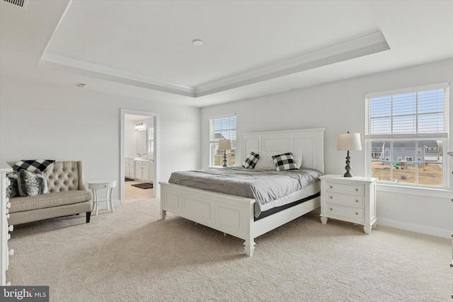 bedroom featuring light carpet, visible vents, a raised ceiling, and baseboards