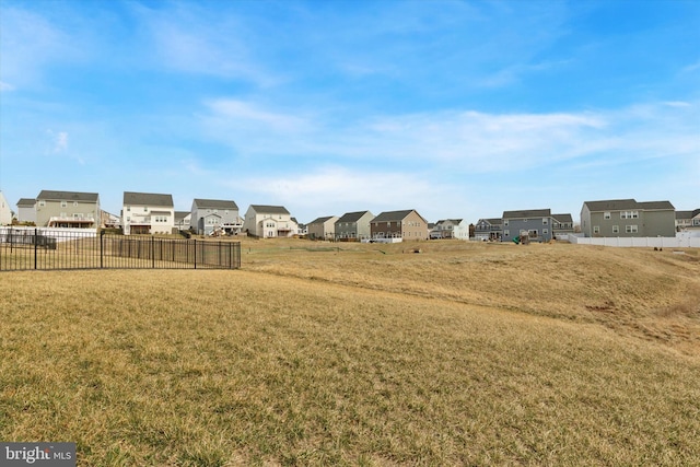 view of yard with fence and a residential view