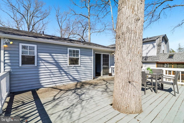 deck with outdoor dining area