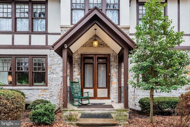 view of exterior entry featuring french doors