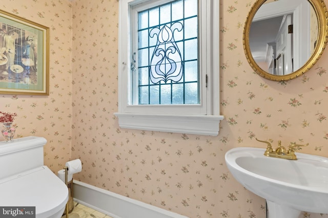 bathroom with toilet and sink