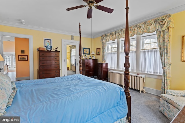 carpeted bedroom featuring ornamental molding, radiator, and ceiling fan