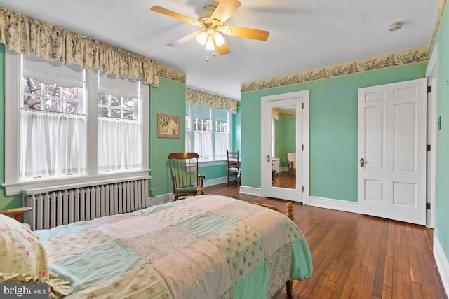 bedroom featuring ceiling fan, dark hardwood / wood-style floors, and radiator