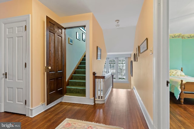 hallway with dark hardwood / wood-style floors