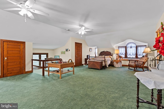 bedroom featuring lofted ceiling and dark colored carpet