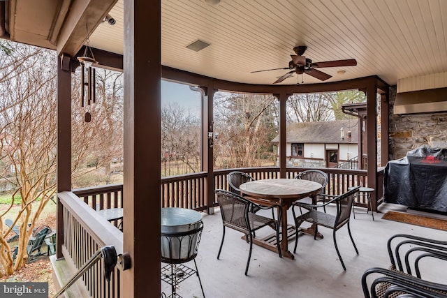 view of patio with area for grilling and ceiling fan