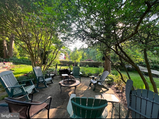 view of patio featuring a fire pit