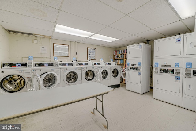 laundry area with stacked washer and dryer and washing machine and dryer