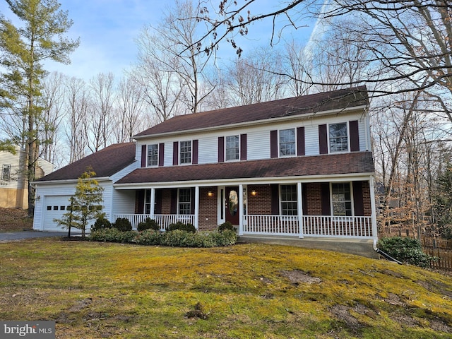 colonial-style house with a garage, covered porch, and a front lawn