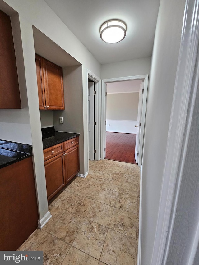 kitchen with dark stone countertops