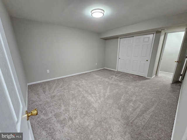 unfurnished bedroom featuring a closet and carpet