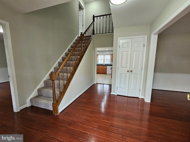 staircase with wood-type flooring