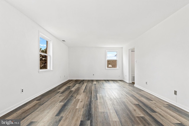 unfurnished room featuring dark hardwood / wood-style floors