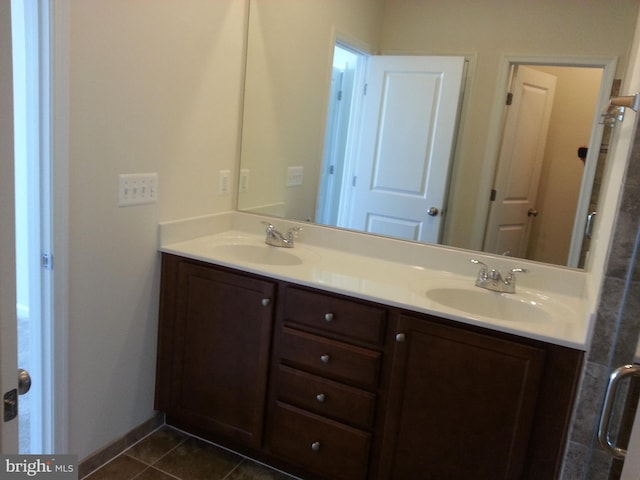 bathroom featuring tile patterned flooring and vanity