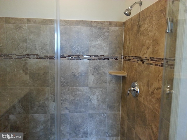 bathroom with tiled shower