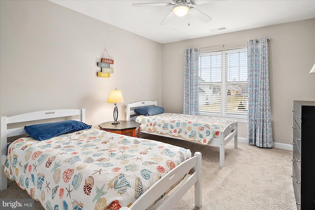 carpeted bedroom featuring ceiling fan