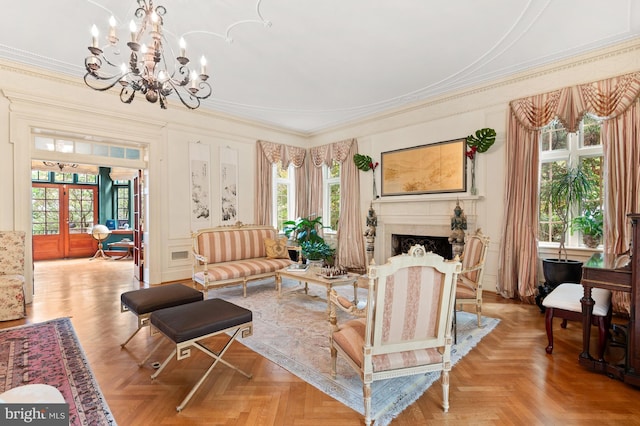 sitting room with a fireplace and crown molding