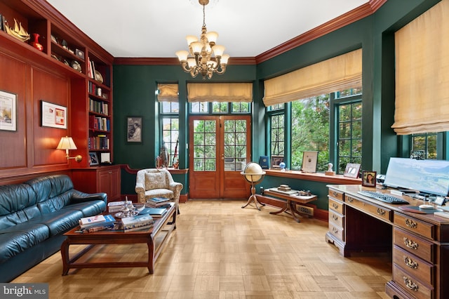 interior space featuring ornamental molding, french doors, a notable chandelier, and built in shelves