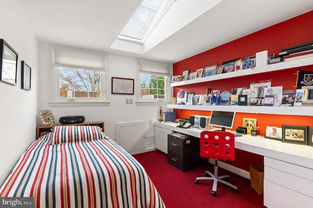 carpeted bedroom with a skylight