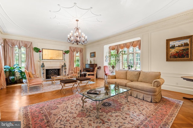 living room featuring plenty of natural light, a fireplace, and a decorative wall