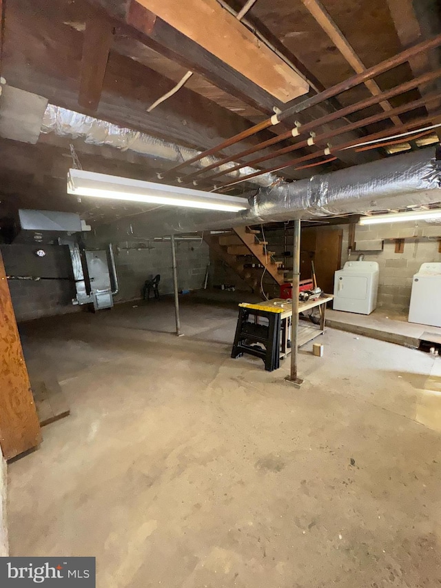 basement with washer and clothes dryer