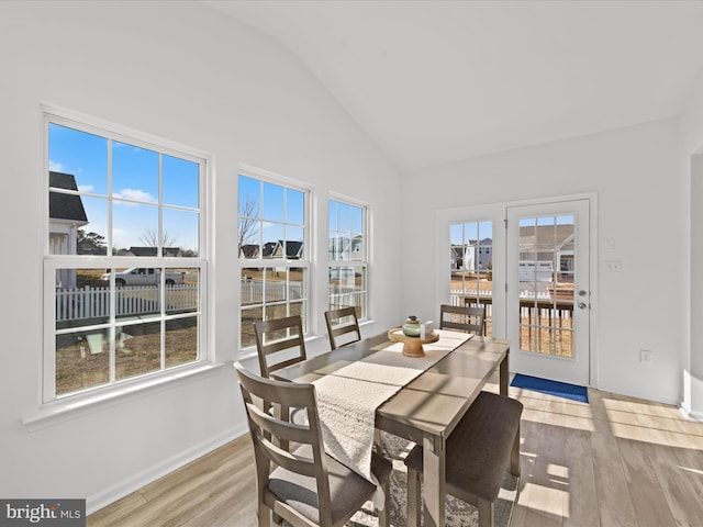 sunroom featuring a healthy amount of sunlight and lofted ceiling