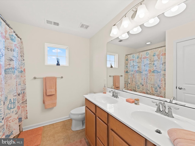 bathroom with walk in shower, vanity, and toilet