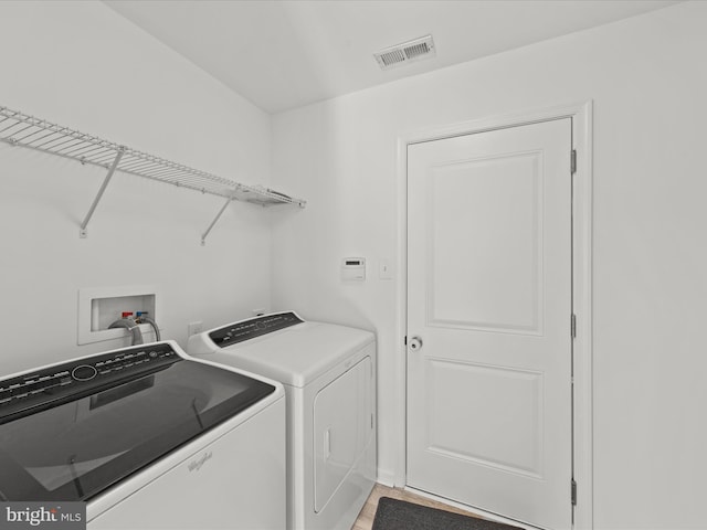 laundry area with washer and clothes dryer