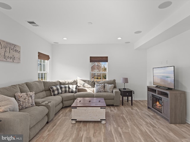 living room with light hardwood / wood-style floors